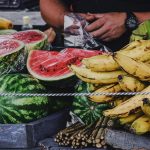 person holding banana fruit and watermelon
